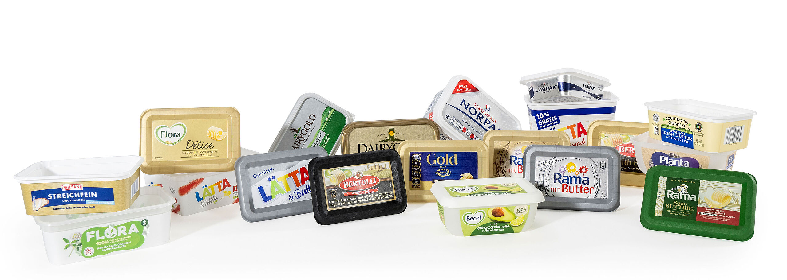 Several different types of food packaging for spreadable fats.